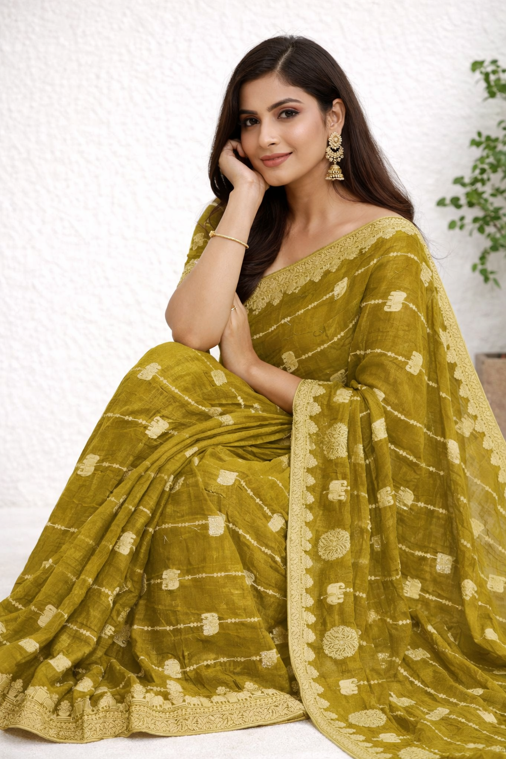Olive Green Designer Saree with Gold Elephant Motifs & Rich Border